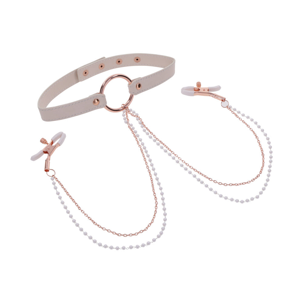The Peaches 'n Cream Collar and Nipple Clamps by Sportsheets showcase a white adjustable collar with rose gold hardware, featuring a central ring that connects to rose gold nipple clamps via delicate chains. The clamps are finished with white tips, and the chains are embellished with small beads for an elegant touch.