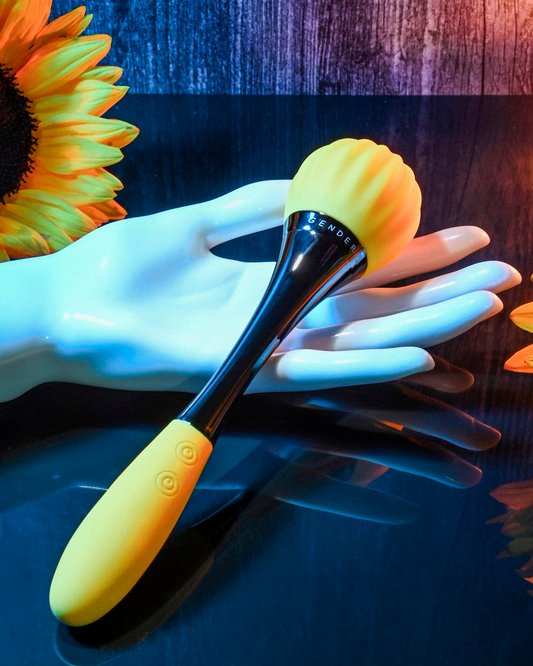 Gender X Sunflower Double Ended Waterproof Dual Motor Vibrator held by model hand