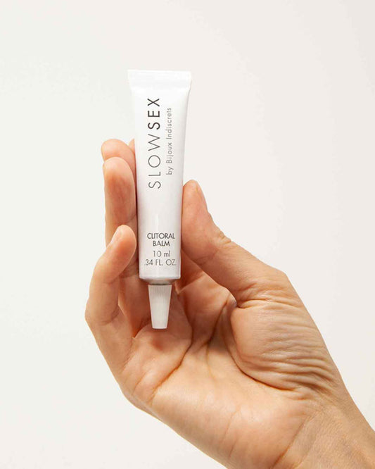 Bijoux Indiscrets Slow Sex Clitoral Balm tube in model's hand