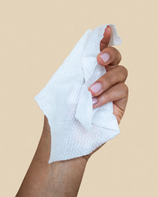 Dame Aloe Infused Body Wipes held in model's hand