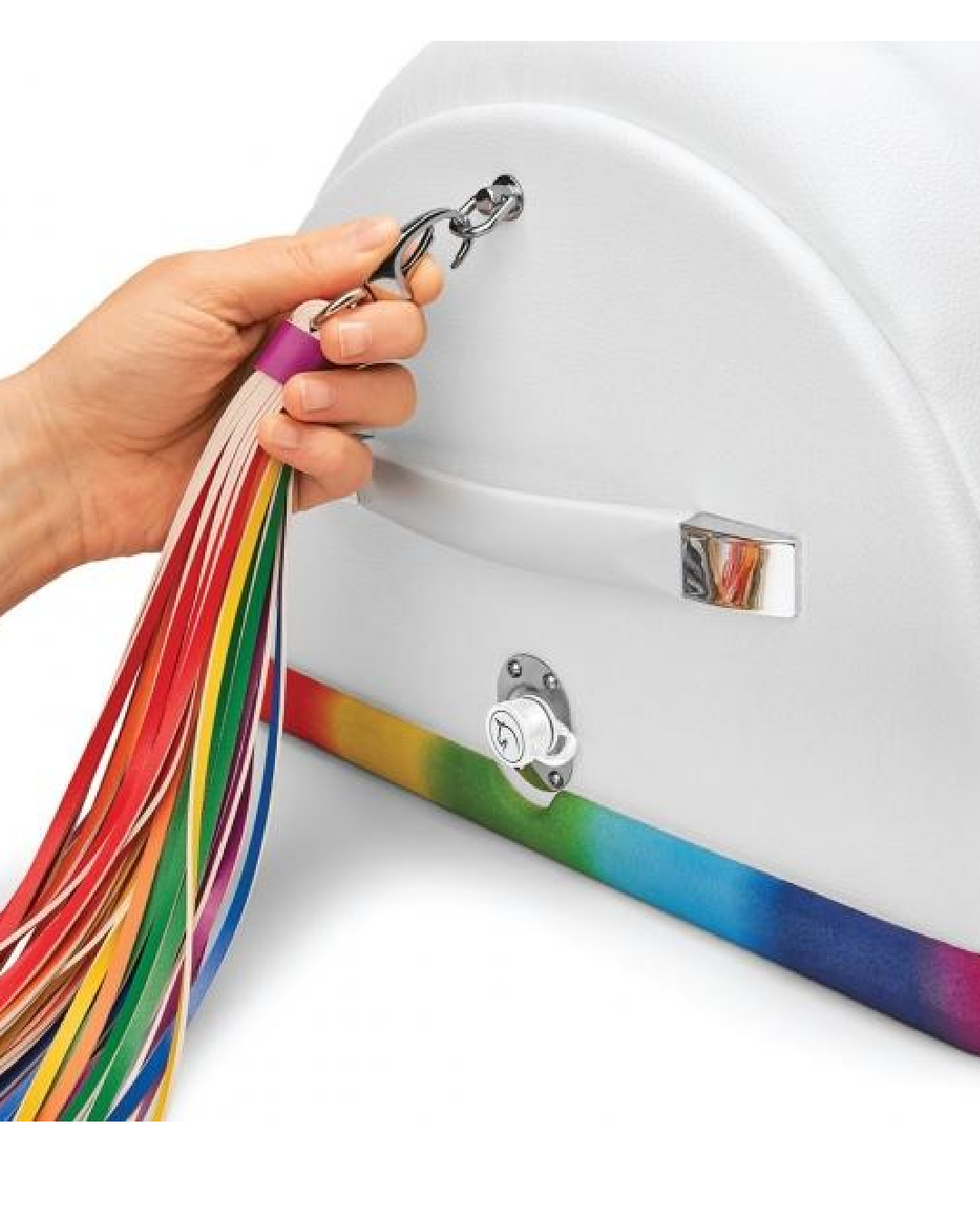 The Cowgirl Unicorn Premium Sex Machine showing close up of rainbow flogger tail  held in model's hand