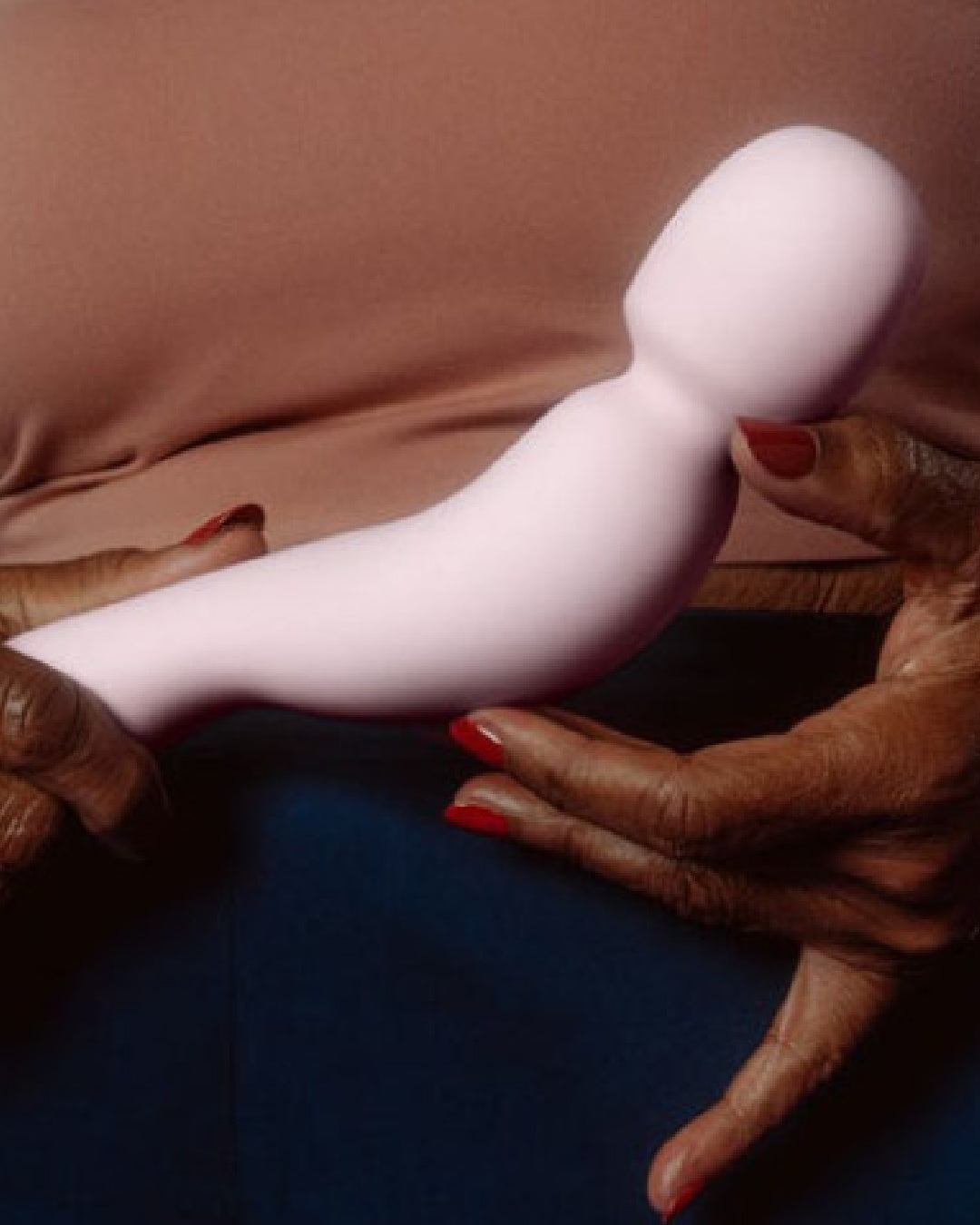 Dame Com Wand Vibrator - Quartz  held in model's hand