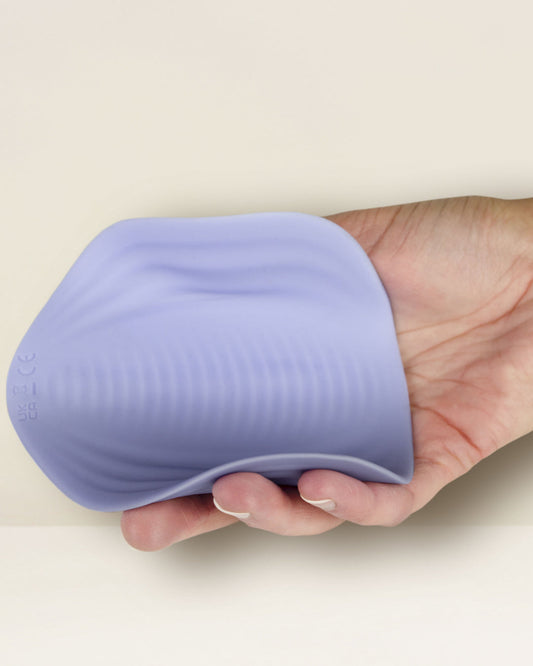 Niya N5 Flexible External Lay On Vibrator with Remote in hand