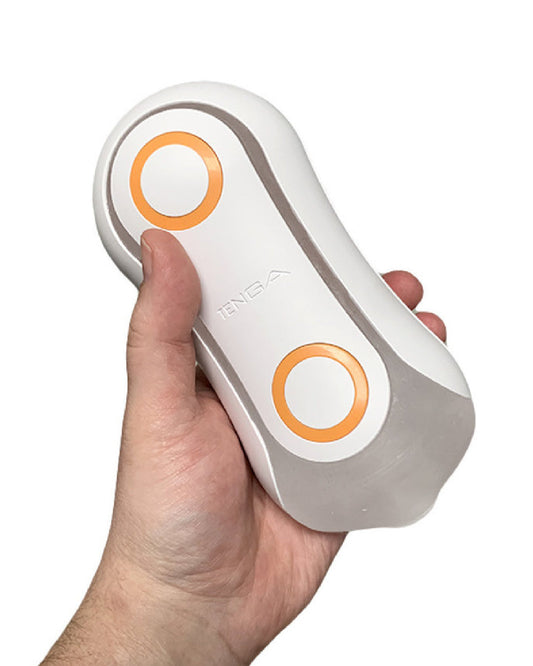 Tenga Flip Orb Penis Masturbator - Orange Crash held in a hand