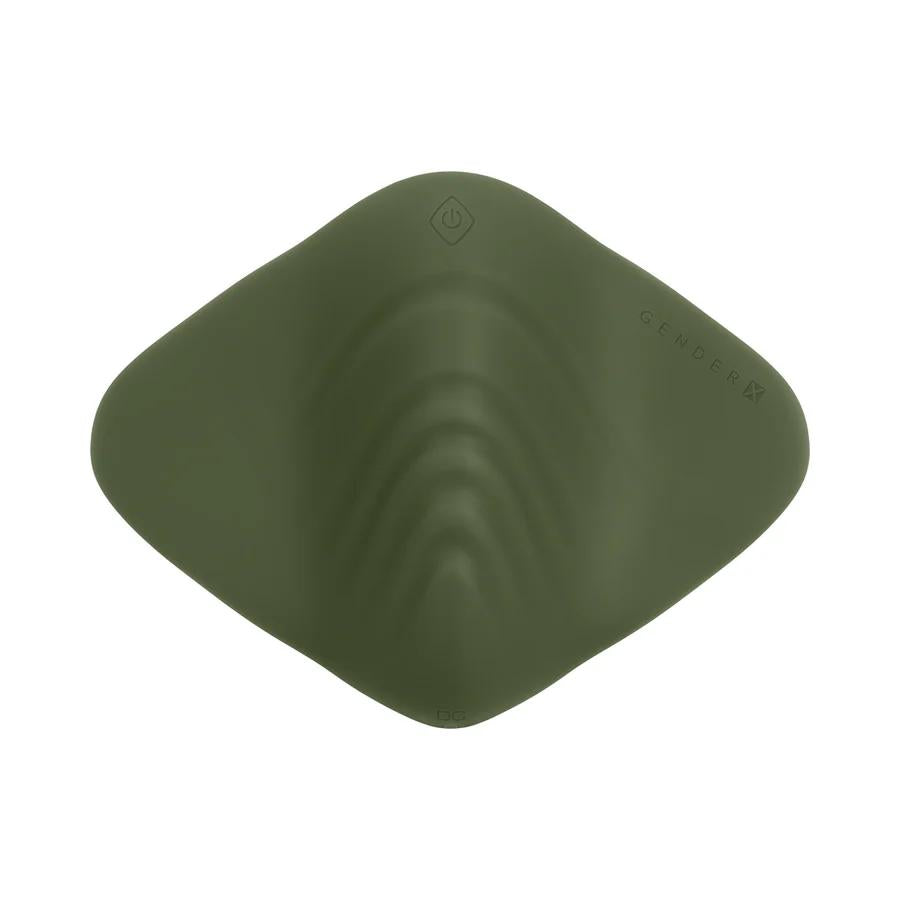 The Gender X Pleasure Pad Rechargeable Grinding Pad & Stroker is a flat, olive green silicone pad with gentle ridges, a diamond-patterned center, and "GENDERX" embossed near the edge; it's waterproof for versatile pleasure.
