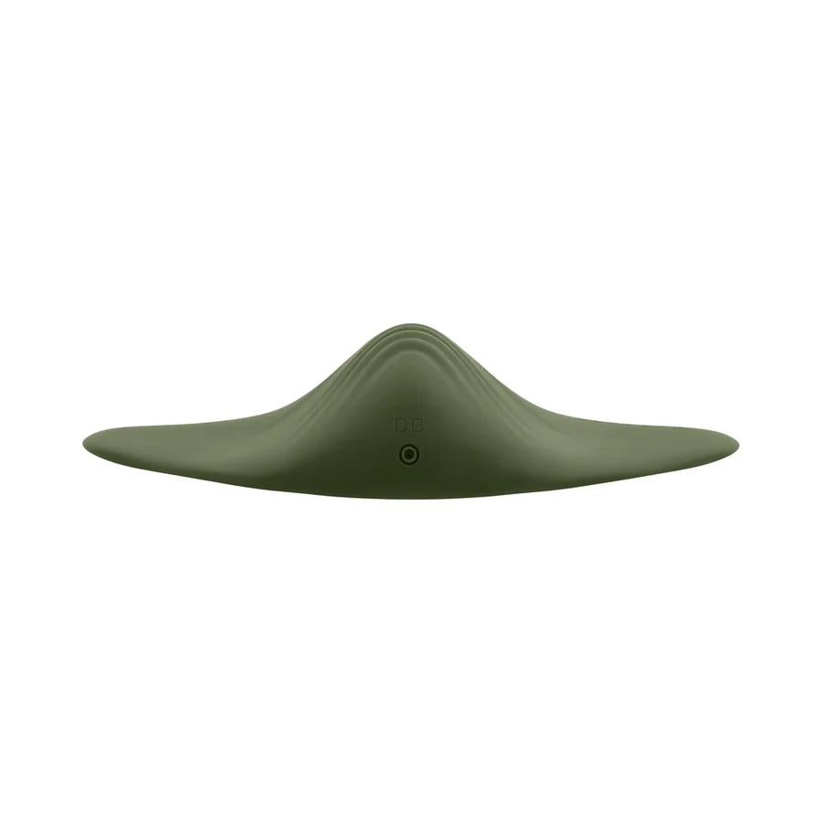 The Gender X Pleasure Pad Rechargeable Grinding Pad & Stroker is a green, smooth, curved device shaped like a stealth aircraft or manta ray, shown front-on against a white background with a “DC” button below the center ridge.