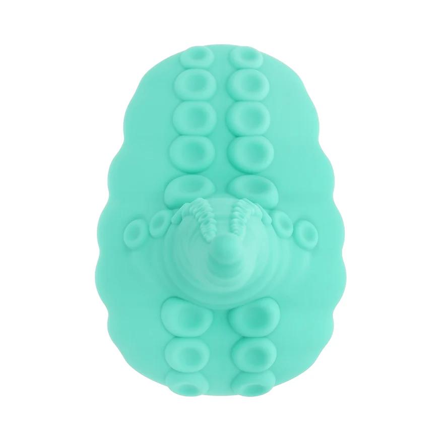 A teal Octopus Tentacle Insertable Remote Controlled Grinder, oval-shaped with raised circular bumps resembling suction cups, is shown from above on a white background.