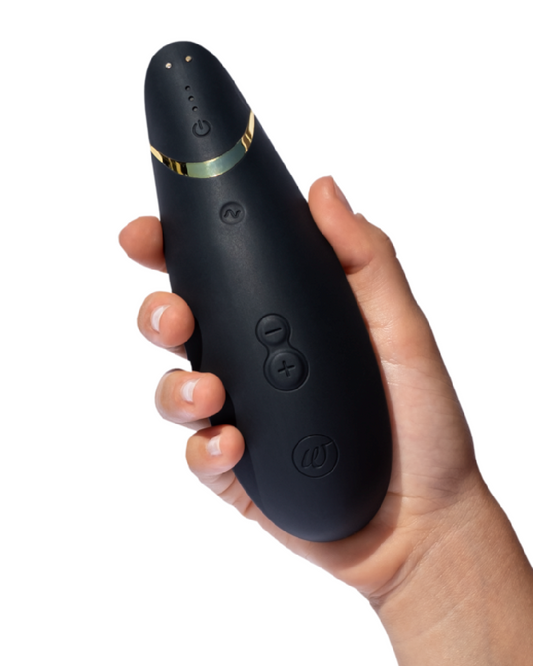 Womanizer Premium 2 Pleasure Air Clitoral Stimulator - Black in model's hand 
