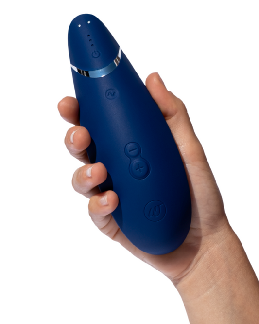 Womanizer Premium 2 Pleasure Air Clitoral Stimulator - Blueberry held in model's hand
