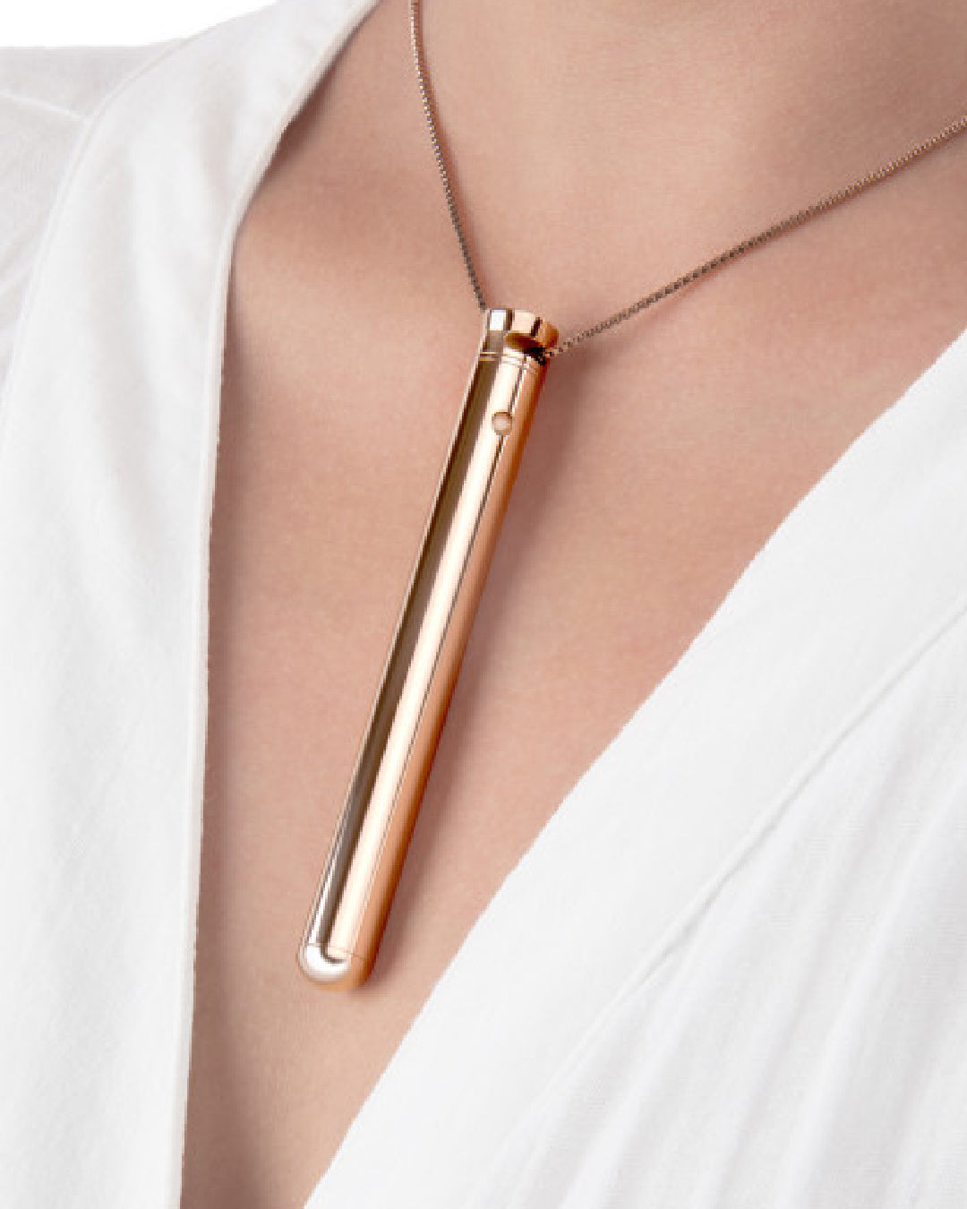 Le Wand Vibrating Necklace - Rose Gold around model's neck 