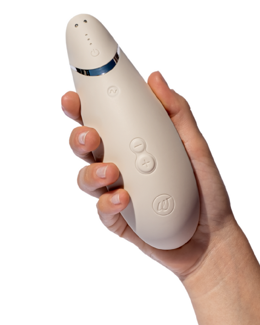 Womanizer Premium 2 Pleasure Air Clitoral Stimulator - Warm Gray in model's hand