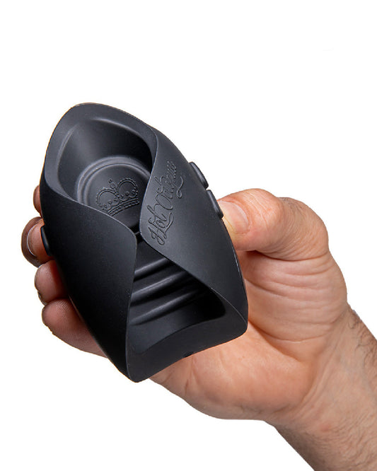 Hot Octopuss Pulse Solo Essential Oscillating Penis Masturbator held in a hand on a white background