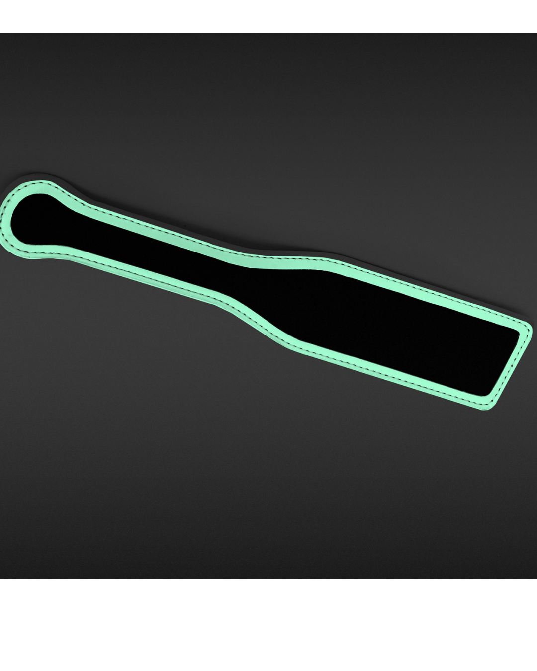 Black paddle glowing in the dark on black background 