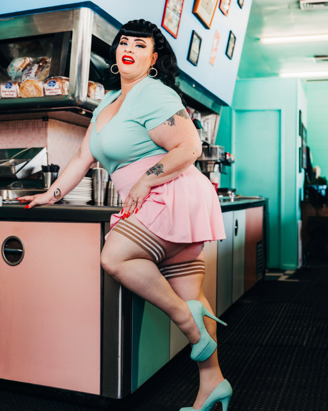 Kix'ies Samantha Barely There Nude Fishnet Thigh Highs (sizes A-D) on model plus size pinup